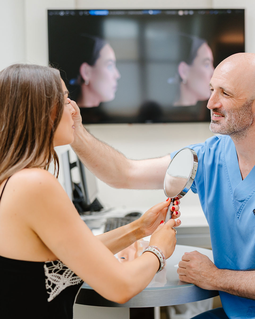Dr Christoph Grill analysing a patient's eye area — Kuzbari Centre Vienna